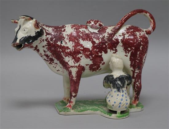 A 19th century Staffordshire cow creamer width 21cm height 15cm